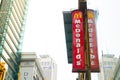 Mcdonald`s logo in vertical with its reflection on glass window building. Royalty Free Stock Photo